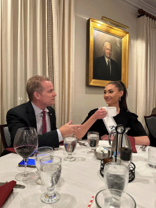 Commissioner Louis Sola (L) & Morgan Romano Miss USA 2022 (R) discussing the topics of Science, Technology, Engineering and Math (STEM) education and STEM opportunities that exist for women in shipping.