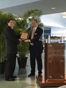 On November 20, 2019, Commissioner Sola spoke to the Florida Customs Brokers and Forwarders Association and presented a retirement plaque to retired South Florida Area Representative Andrew Margolis.